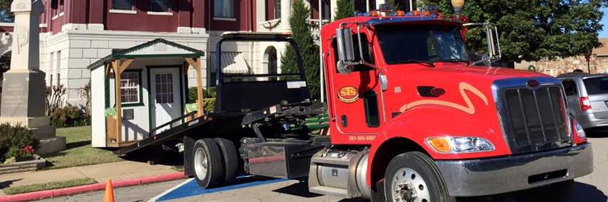 searcy towing & auto works truck moving a shed