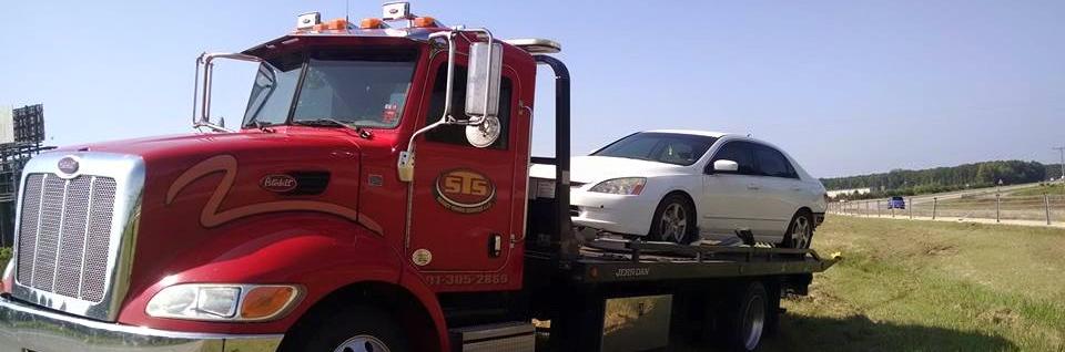 tow truck towing a car